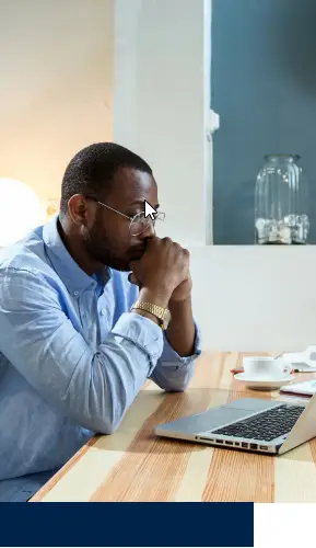 Frustrated man sitting at a table why his home did not sell and his listing expired